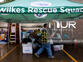 Volunteers collect donations at the Lansing Volunteer Fire Department in Lansing, North Carolina on September 30, 2024, after Hurricane Hele...