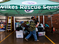 Volunteers collect donations at the Lansing Volunteer Fire Department in Lansing, North Carolina on September 30, 2024, after Hurricane Hele...