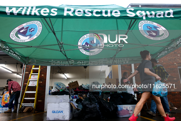 Volunteers collect donations at the Lansing Volunteer Fire Department in Lansing, North Carolina on September 30, 2024, after Hurricane Hele...