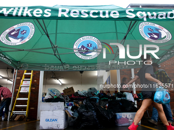 Volunteers collect donations at the Lansing Volunteer Fire Department in Lansing, North Carolina on September 30, 2024, after Hurricane Hele...