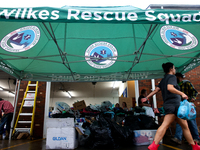 Volunteers collect donations at the Lansing Volunteer Fire Department in Lansing, North Carolina on September 30, 2024, after Hurricane Hele...