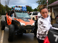 Volunteers deliver donations at the Lansing Volunteer Fire Department in Lansing, North Carolina on September 30, 2024, after Hurricane Hele...