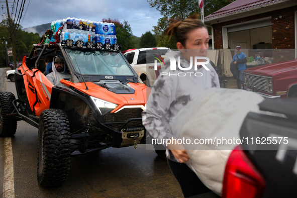 Volunteers deliver donations at the Lansing Volunteer Fire Department in Lansing, North Carolina on September 30, 2024, after Hurricane Hele...