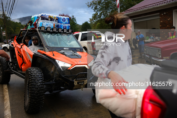 Volunteers deliver donations at the Lansing Volunteer Fire Department in Lansing, North Carolina on September 30, 2024, after Hurricane Hele...