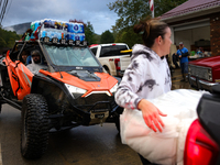 Volunteers deliver donations at the Lansing Volunteer Fire Department in Lansing, North Carolina on September 30, 2024, after Hurricane Hele...