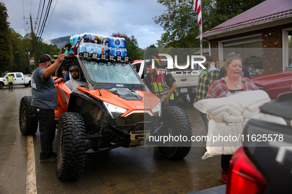 Volunteers deliver donations at the Lansing Volunteer Fire Department in Lansing, North Carolina on September 30, 2024, after Hurricane Hele...