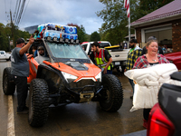 Volunteers deliver donations at the Lansing Volunteer Fire Department in Lansing, North Carolina on September 30, 2024, after Hurricane Hele...