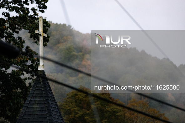 A church steeple rises in front of evening fog in Lansing, North Carolina on September 30, 2024 after Hurricane Helene caused widespread dam...