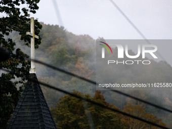 A church steeple rises in front of evening fog in Lansing, North Carolina on September 30, 2024 after Hurricane Helene caused widespread dam...