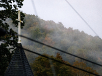 A church steeple rises in front of evening fog in Lansing, North Carolina on September 30, 2024 after Hurricane Helene caused widespread dam...