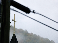 A church steeple rises in front of evening fog in Lansing, North Carolina on September 30, 2024 after Hurricane Helene caused widespread dam...