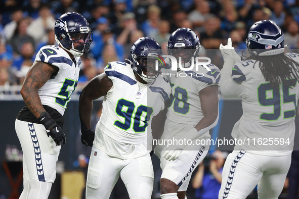 DETROIT,MICHIGAN-September 30: Seattle Seahawks defensive tackle Jarran Reed (90) celebrates with teammates after a play during the first ha...