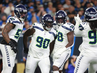 DETROIT,MICHIGAN-September 30: Seattle Seahawks defensive tackle Jarran Reed (90) celebrates with teammates after a play during the first ha...