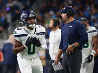 DETROIT,MICHIGAN-September 30:Seattle Seahawks head coach Mike Macdonald talks to linebacker Tyrel Dodson (0) during the first half of an NF...