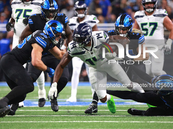 DETROIT,MICHIGAN-September 30: Seattle Seahawks wide receiver DK Metcalf (14) runs the ball during the first half of an NFL football game be...