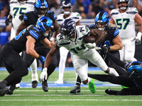 DETROIT,MICHIGAN-September 30: Seattle Seahawks wide receiver DK Metcalf (14) runs the ball during the first half of an NFL football game be...