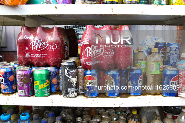 Damaged products sit on a shelf outside of CJ's Market in Lansing, North Carolina on September 30, 2024 after Hurricane Helene destroyed the...