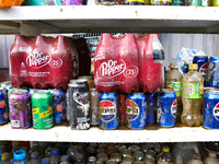 Damaged products sit on a shelf outside of CJ's Market in Lansing, North Carolina on September 30, 2024 after Hurricane Helene destroyed the...