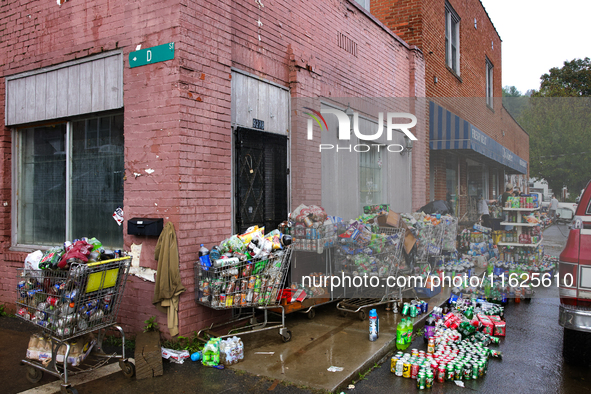 Shopping carts hold damaged products outside of CJ's Market in Lansing, North Carolina on September 30, 2024 after Hurricane Helene destroye...