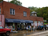 Volunteers clean up storm damage at CJ's Market in Lansing, North Carolina on September 30, 2024 after Hurricane Helene caused widespread da...