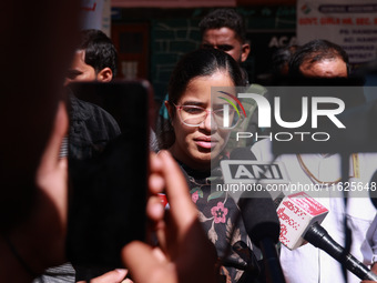 DC Kupwara Ayushi Sudan speaks to the media near a polling station during the third phase of Assembly elections in Handwara, Jammu and Kashm...