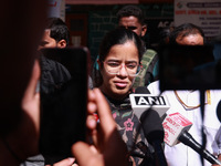 DC Kupwara Ayushi Sudan speaks to the media near a polling station during the third phase of Assembly elections in Handwara, Jammu and Kashm...