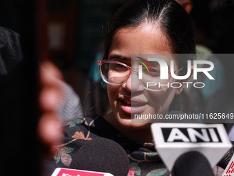 DC Kupwara Ayushi Sudan speaks to the media near a polling station during the third phase of Assembly elections in Handwara, Jammu and Kashm...