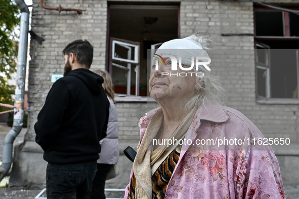 Halyna, a resident of a multi-storey building damaged by a Russian airstrike, is seen with her head bandaged in Zaporizhzhia, Ukraine, on Se...