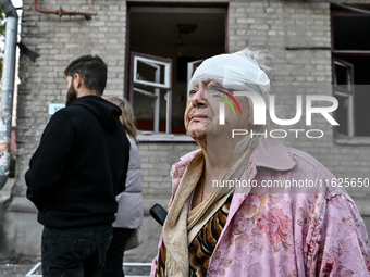 Halyna, a resident of a multi-storey building damaged by a Russian airstrike, is seen with her head bandaged in Zaporizhzhia, Ukraine, on Se...