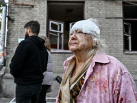 Halyna, a resident of a multi-storey building damaged by a Russian airstrike, is seen with her head bandaged in Zaporizhzhia, Ukraine, on Se...