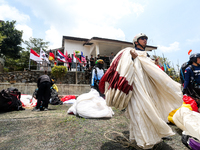 A number of paragliding athletes prepare to take part in a paragliding competition in Sumedang, Indonesia, on October 1, 2024. The paraglidi...