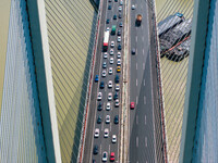 A large number of vehicles move slowly along an expressway in Huai'an, China, on October 1, 2024. (