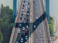 A large number of vehicles move slowly along an expressway in Huai'an, China, on October 1, 2024. (