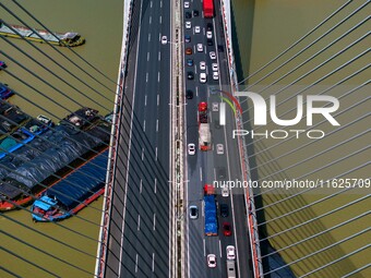 A large number of vehicles move slowly along an expressway in Huai'an, China, on October 1, 2024. (