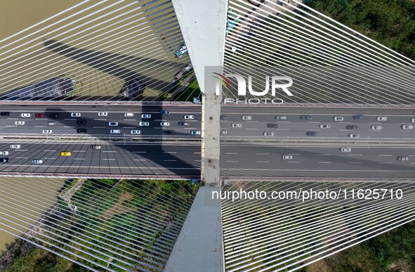 A large number of vehicles move slowly along an expressway in Huai'an, China, on October 1, 2024. 