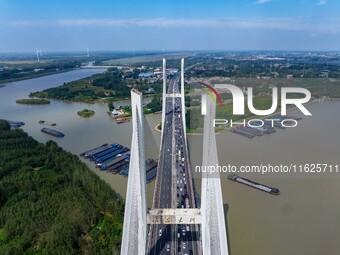 A large number of vehicles move slowly along an expressway in Huai'an, China, on October 1, 2024. (