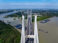 A large number of vehicles move slowly along an expressway in Huai'an, China, on October 1, 2024. (