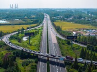 A large number of vehicles move slowly along an expressway in Huai'an, China, on October 1, 2024. (