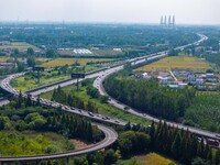 A large number of vehicles move slowly along an expressway in Huai'an, China, on October 1, 2024. (