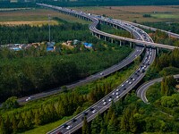 A large number of vehicles move slowly along an expressway in Huai'an, China, on October 1, 2024. (