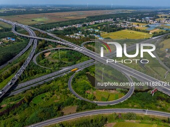 A large number of vehicles move slowly along an expressway in Huai'an, China, on October 1, 2024. (