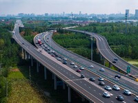 A large number of vehicles move slowly along an expressway in Huai'an, China, on October 1, 2024. (