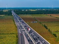 A large number of vehicles move slowly along an expressway in Huai'an, China, on October 1, 2024. (