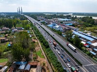 A large number of vehicles move slowly along an expressway in Huai'an, China, on October 1, 2024. (