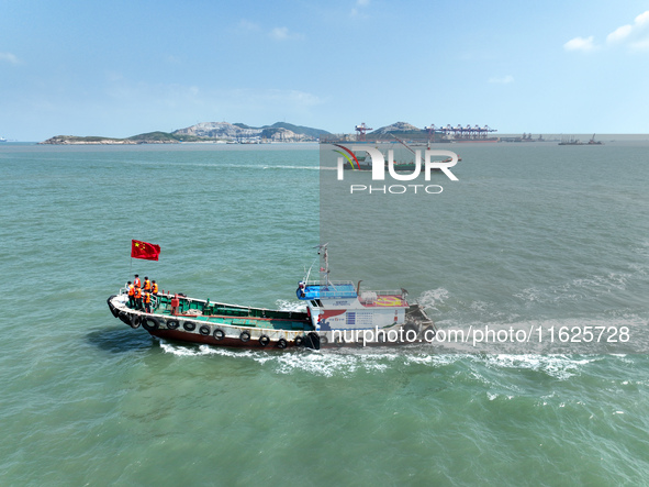 Police aboard a ''Hongfan 110'' boat conduct a maritime patrol operation in Zhoushan, China, on October 1, 2024. 