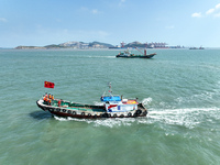 Police aboard a ''Hongfan 110'' boat conduct a maritime patrol operation in Zhoushan, China, on October 1, 2024. (