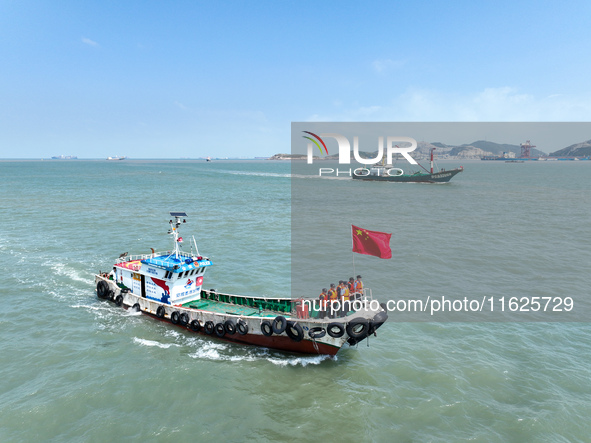 Police aboard a ''Hongfan 110'' boat conduct a maritime patrol operation in Zhoushan, China, on October 1, 2024. 