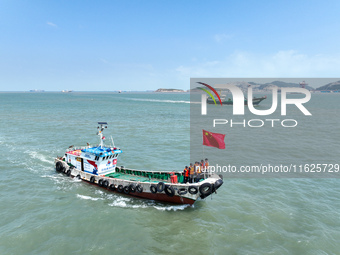 Police aboard a ''Hongfan 110'' boat conduct a maritime patrol operation in Zhoushan, China, on October 1, 2024. (