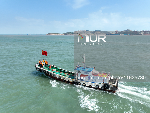 Police aboard a ''Hongfan 110'' boat conduct a maritime patrol operation in Zhoushan, China, on October 1, 2024. 