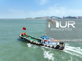 Police aboard a ''Hongfan 110'' boat conduct a maritime patrol operation in Zhoushan, China, on October 1, 2024. (